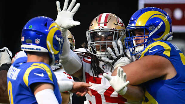 Oct 30, 2022; Inglewood, California, USA; San Francisco 49ers linebacker Fred Warner (54) and Los Angeles Rams quarterback Matthew Stafford (9) and Los Angeles Rams offensive tackle Rob Havenstein (79) during the third quarter at SoFi Stadium. Mandatory Credit: Robert Hanashiro-USA TODAY Sports